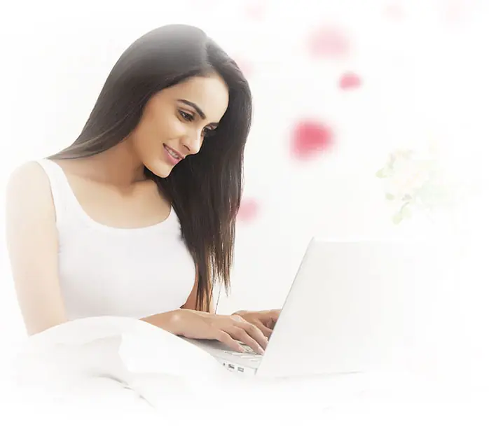Woman using a laptop for an iDates virtual conversation